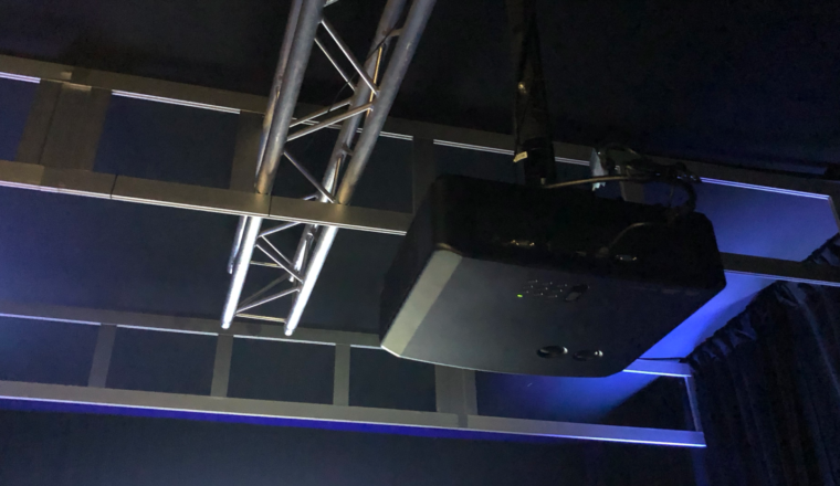 The LX-NZ38 mounted in the truss work in their black box  room, at CEDIA 2019.  Impressive!